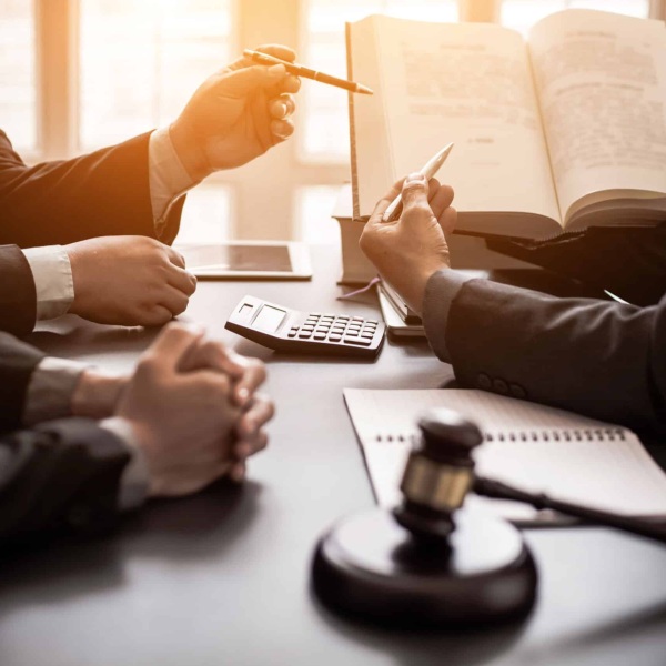 Image Shows: lawyers discussing