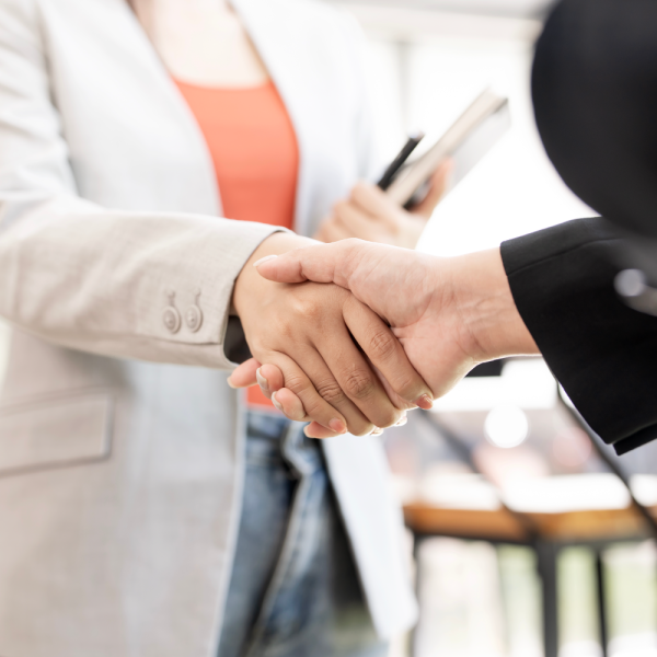 Image Shows: People shaking hands.