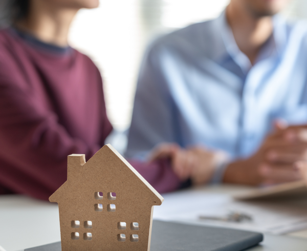 Image Shows: indication that couple trying buy a house