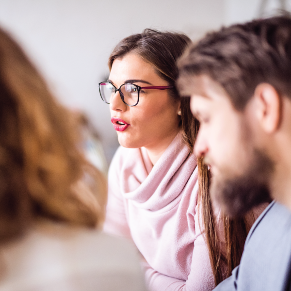 Image Shows: lawyer talking to clients