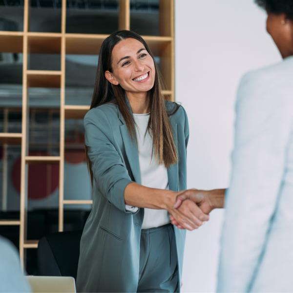 Image Shows: person shaking hands with another person