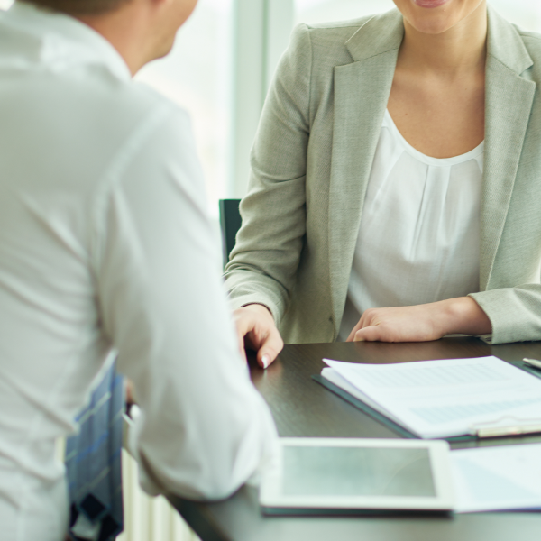 Image Shows: two adults in a meeting
