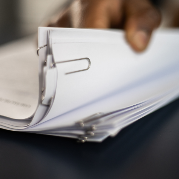 Image Shows: multiple documents on a table.