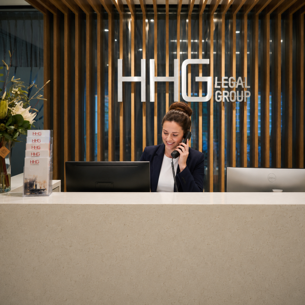 Image Shows: Photograph of HHG Legal Group reception, wit receptionist answering the phone
