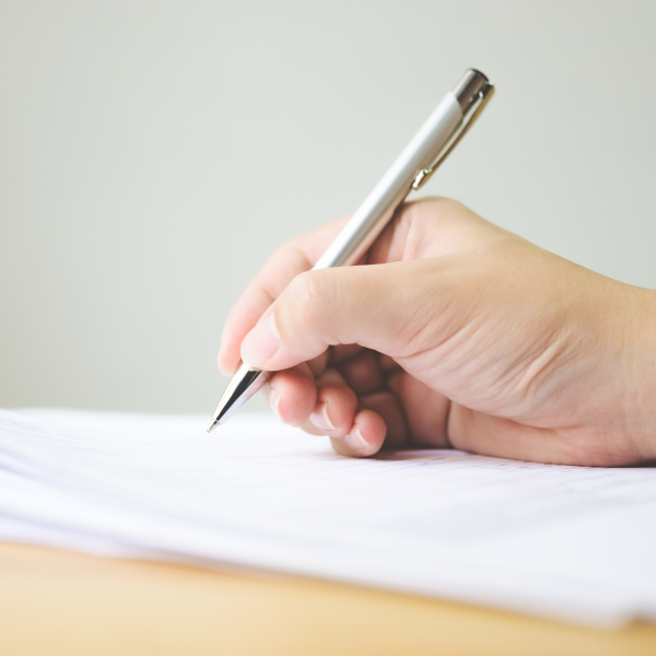 Image Shows: signing papers