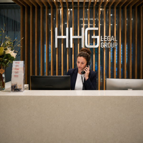 Image Shows: Photograph of HHG Legal Group reception, wit receptionist answering the phone
