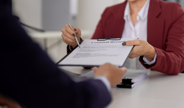 image shows layer handing over a criminal record