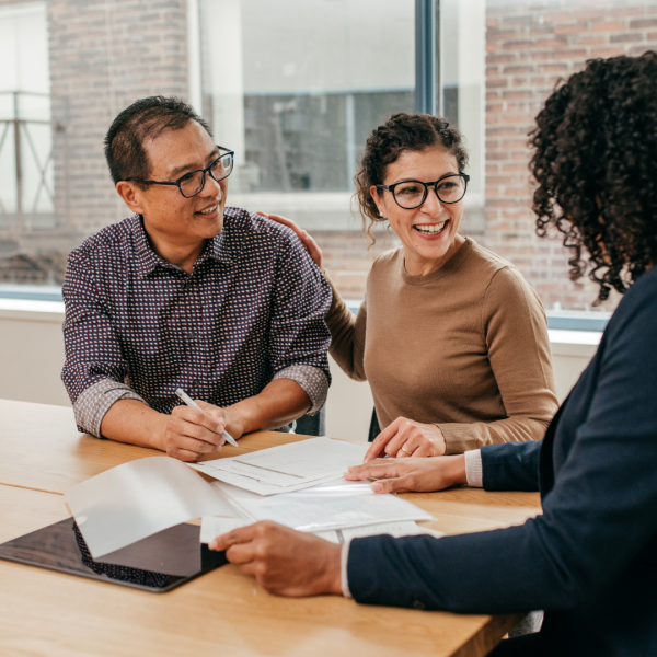 image shows family discussion with lawyer at the firm