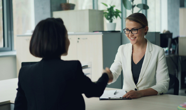 image shows lawyer talking to business owner